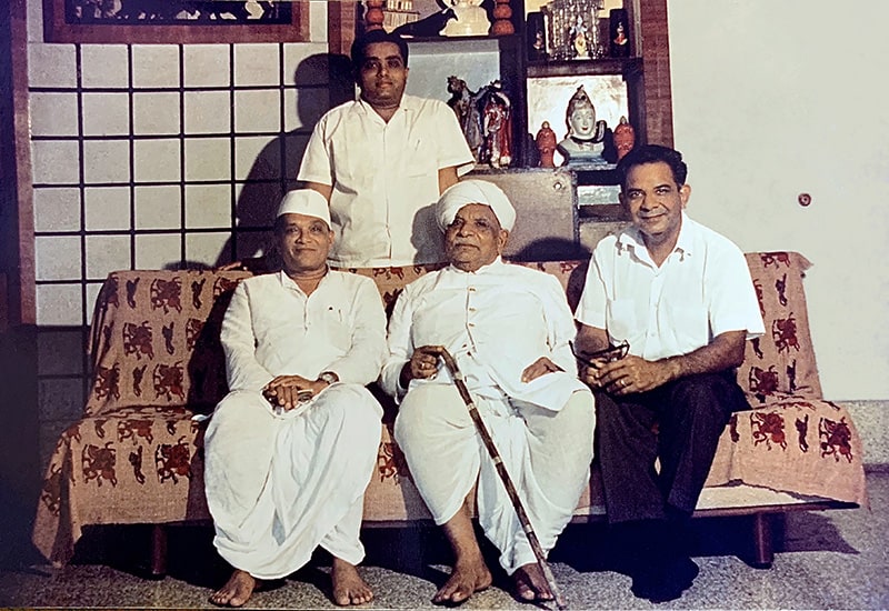 Prabhashankar Sompura – Brahmeshvara Jyotirshivalinga Temple architect in center. Manubhai Patel (standing), Dahyabhai Patel (right), Son of architect (left). 1977.