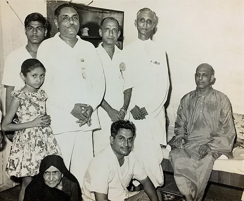 Ramanbhai Patel's Home Photo of Swami Kripalvananda (Swami Kripalu). (Standing, Left to Right): Chimanbhai, Nanubhai, Ramanbhai. 1967.